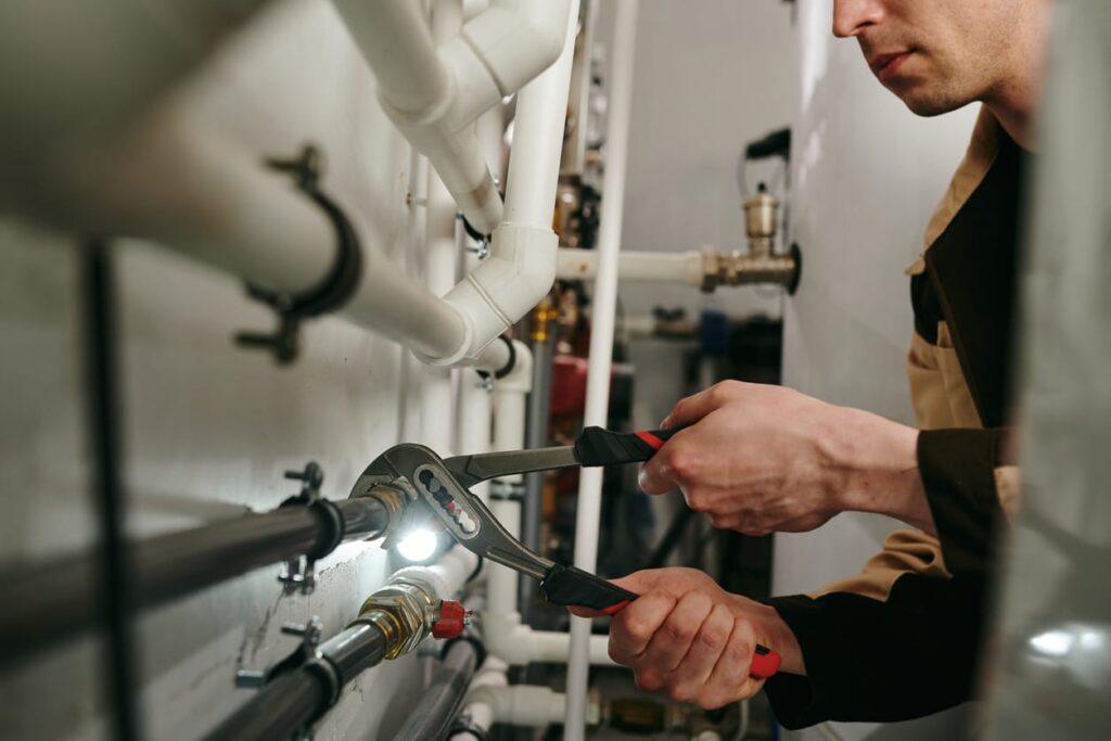Plumbers maintaining commercial plumbing pipes in Panama City Beach